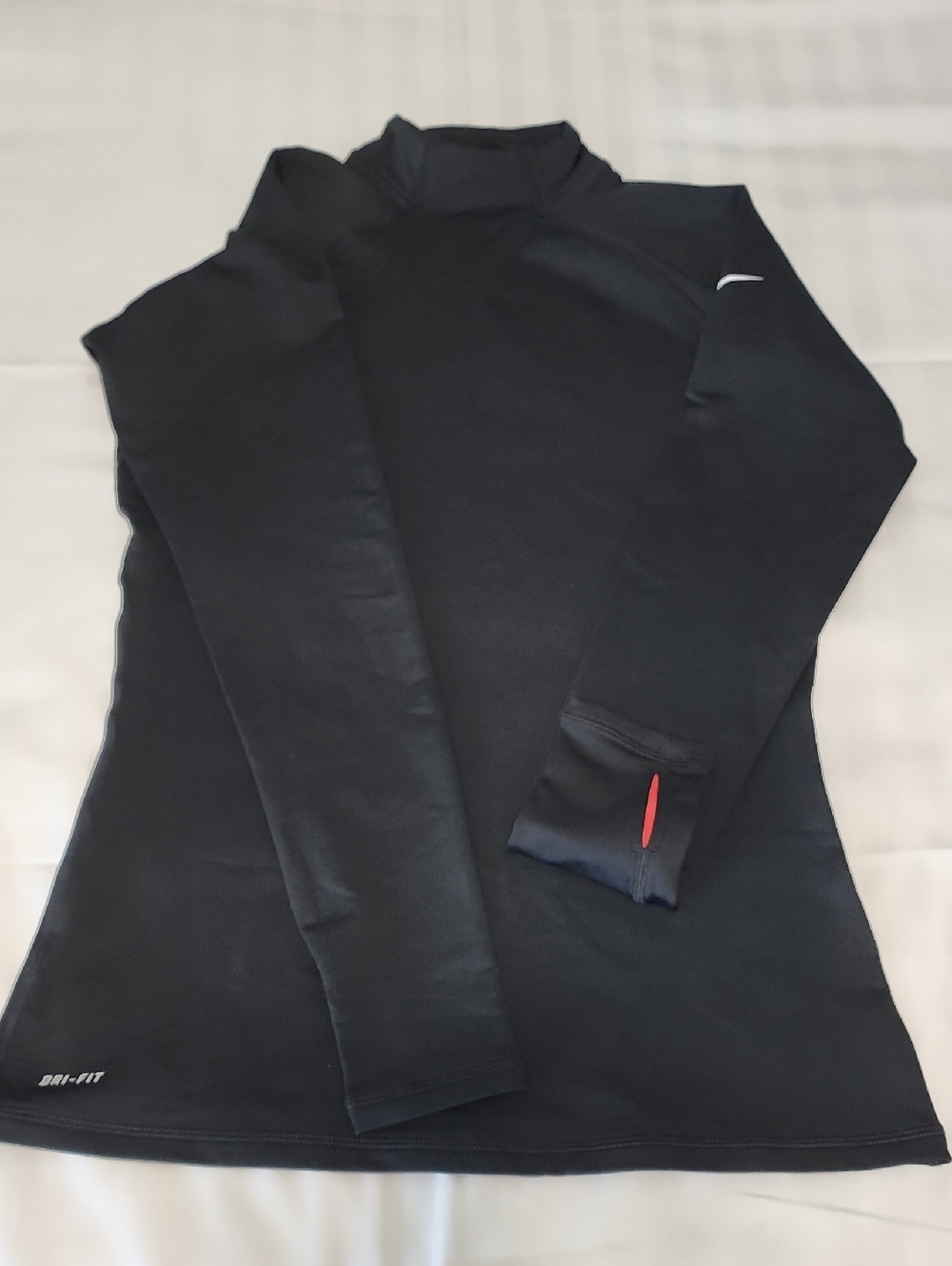 NWOT Nike Black Long-Sleeve Performance Top with Reflective Swoosh